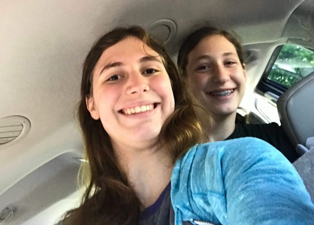 Alexis is home! Picture of her and her sister in the car