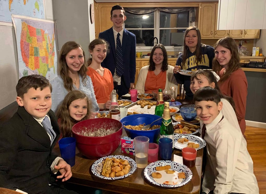 family having a new years eve party around the table