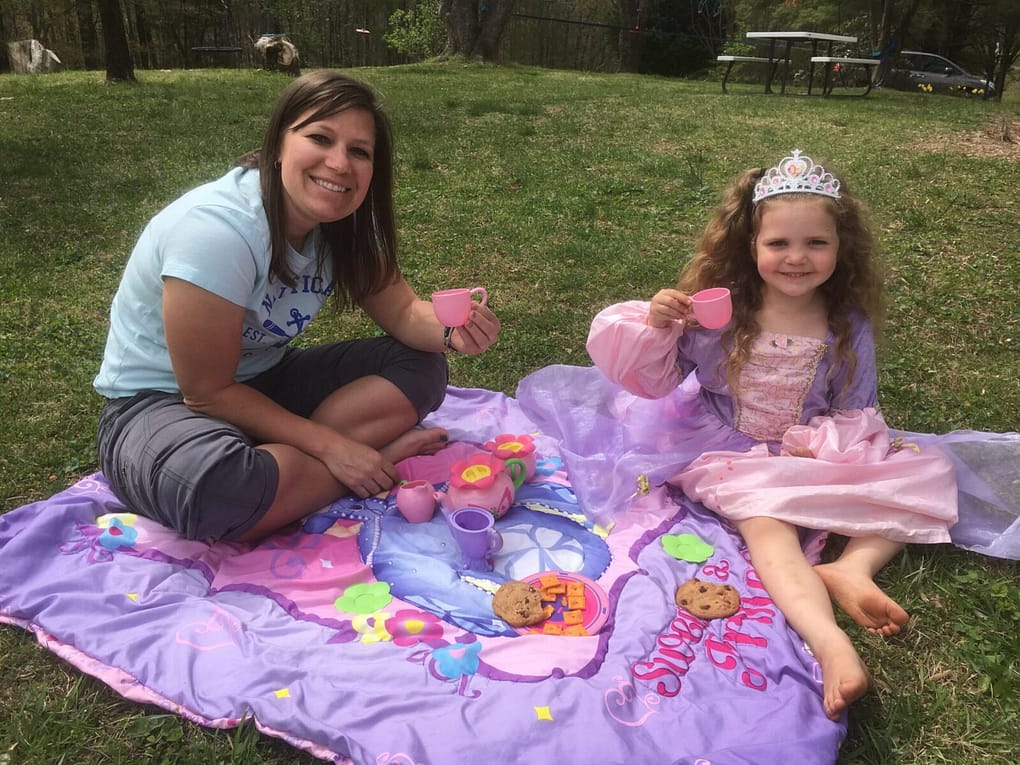 preschool teaparty outside on the grass.