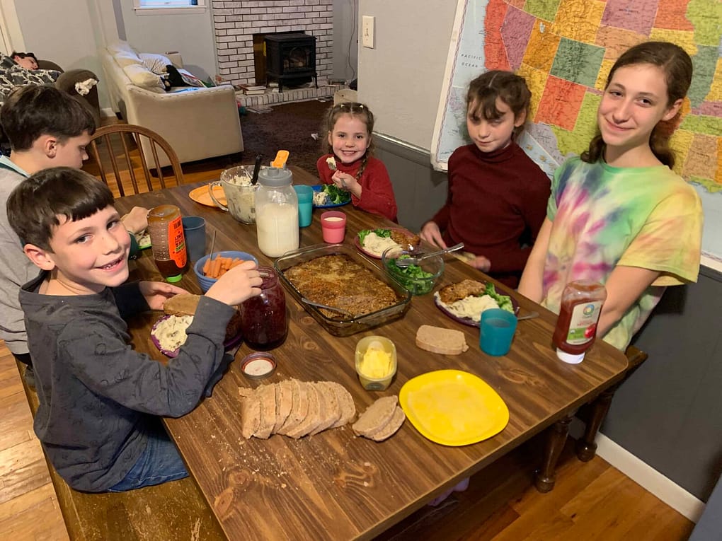 family eating meat loaf for dinner