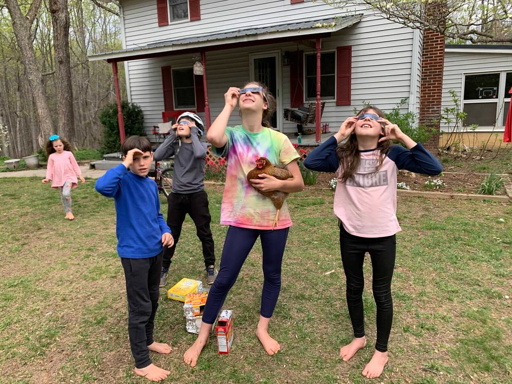 solar2 4 kids looking through solar eclipse glasses