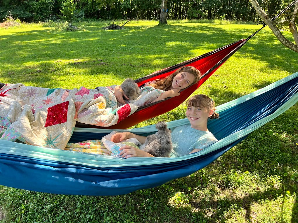 2 teen girls in hammocks