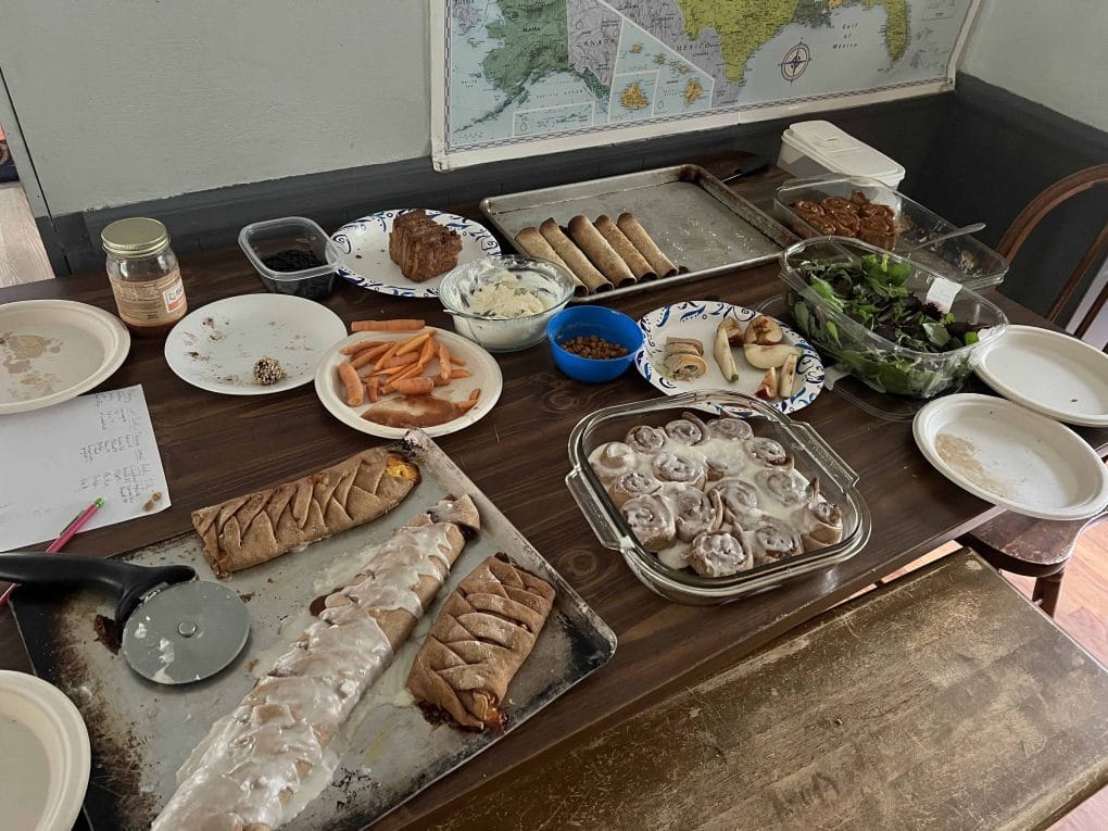 cinnamon rolls and other food on a table