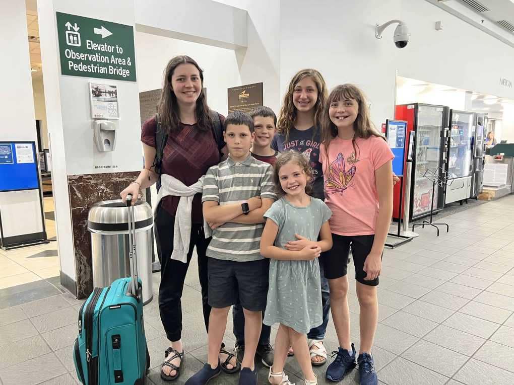 6 kids at the airport