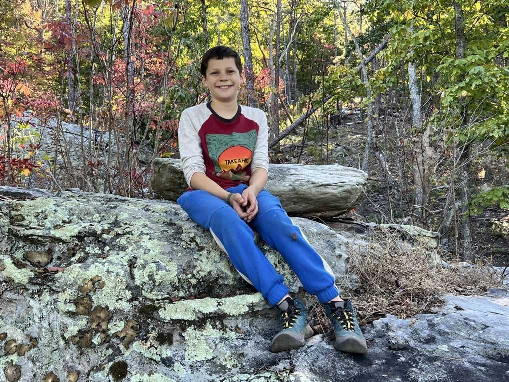 boy resting during a hike