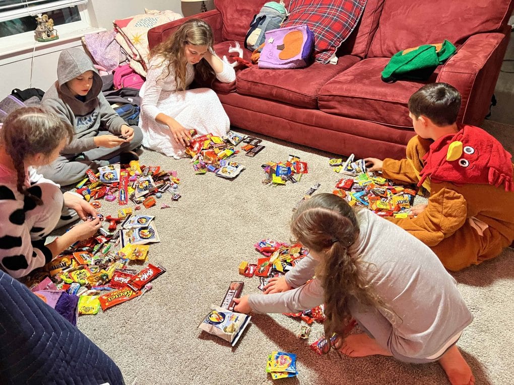 kids sorting through Halloween candy