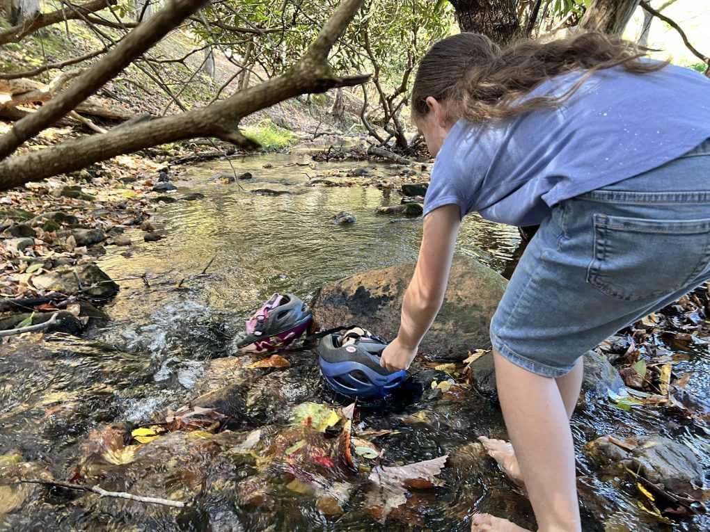 floating dolls in a creek