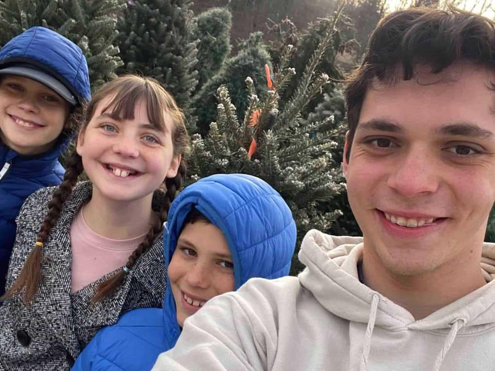4 kids at Christmas tree farm