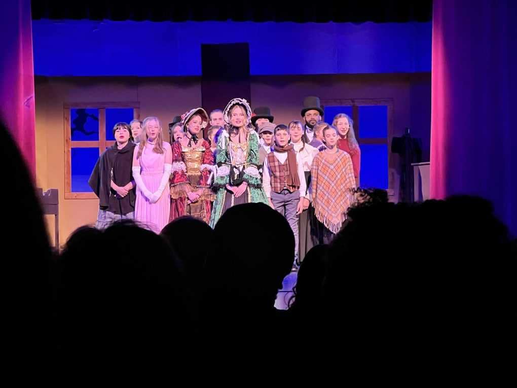 Carolers in Christmas Carol play