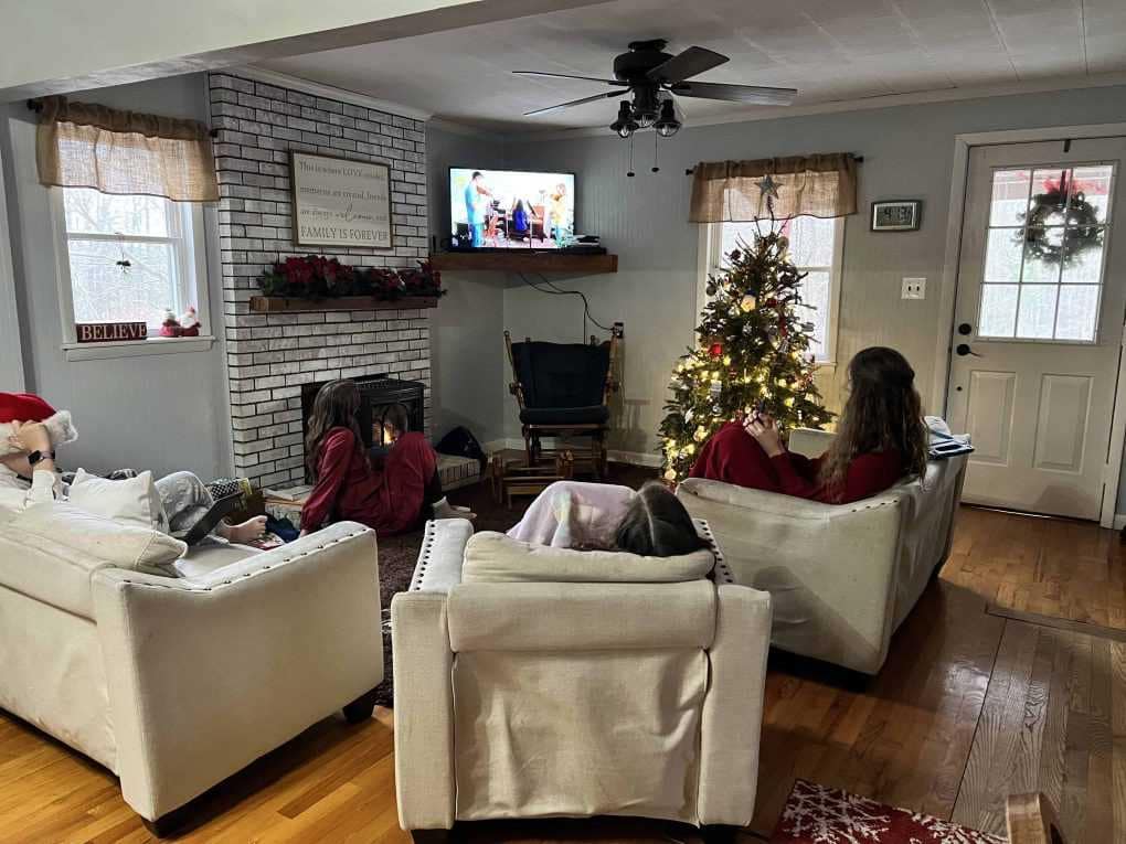 family watching home movies at Christmastime