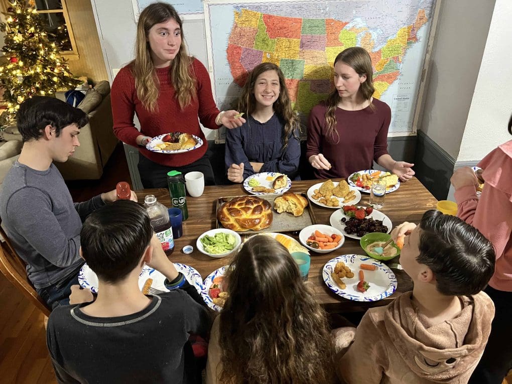 family eating Christmas Eve dinner