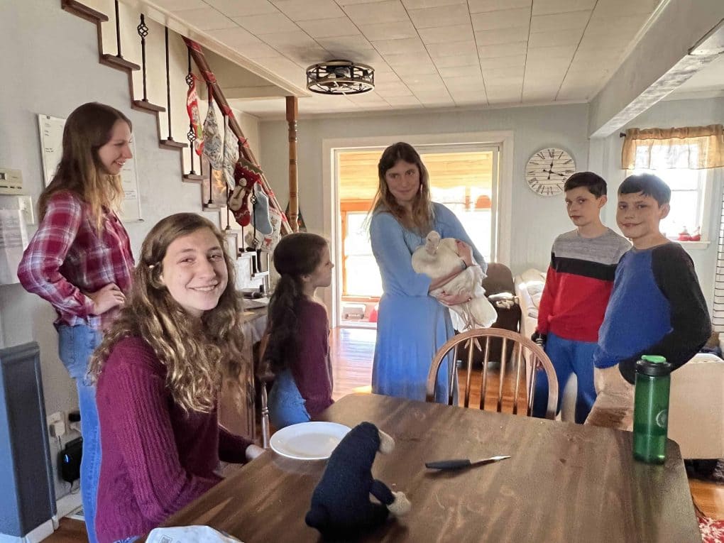 kids on shoulder rides in the dining room