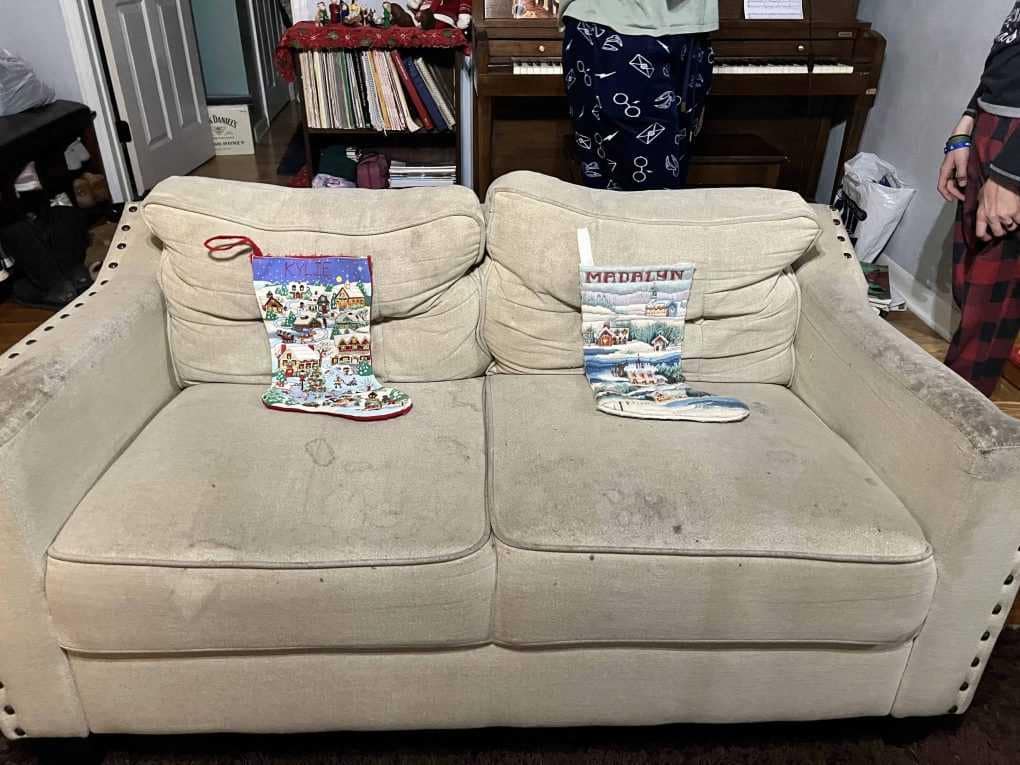 2 stockings on a couch waiting for Santa