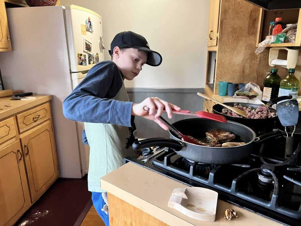 boy flipping fry bread