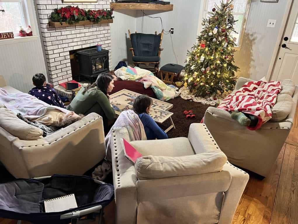sick kids on couches by the Christmas tree