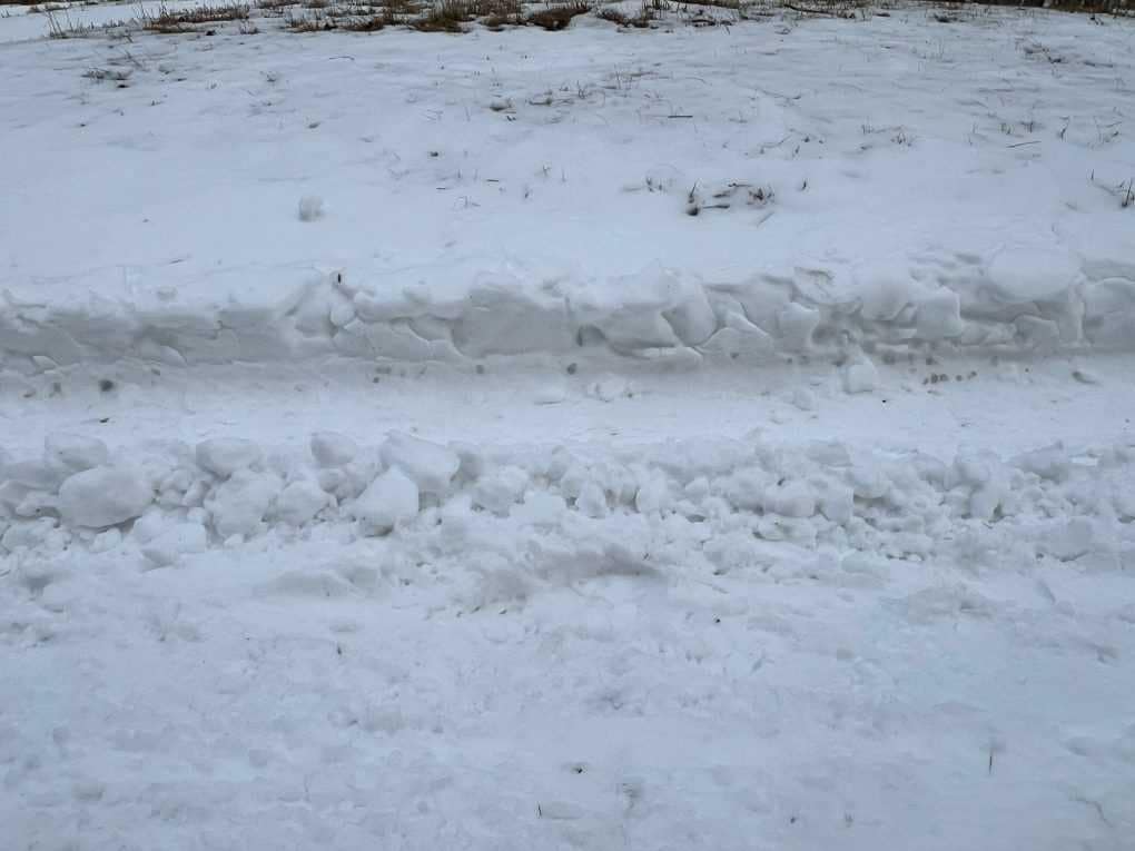 deep tire tracks in snow