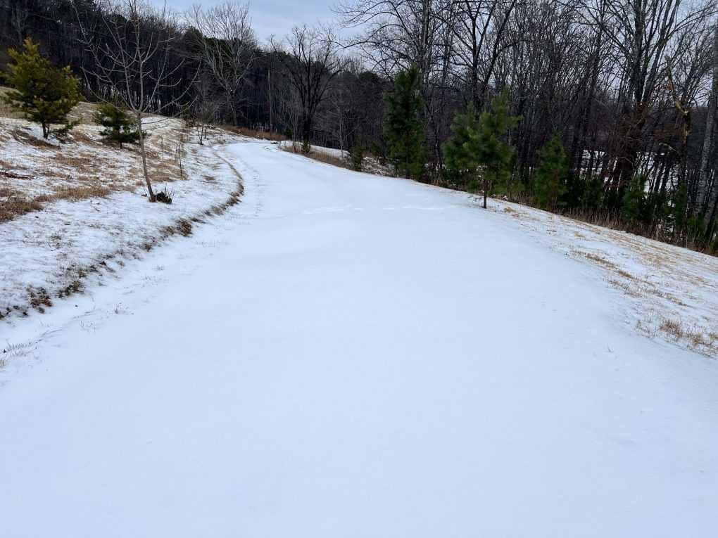 steep country driveway encased in ice