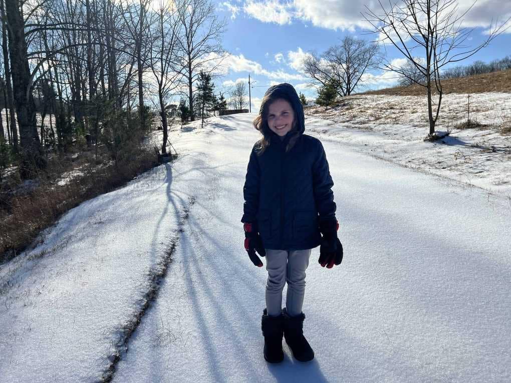 girl on road iced over