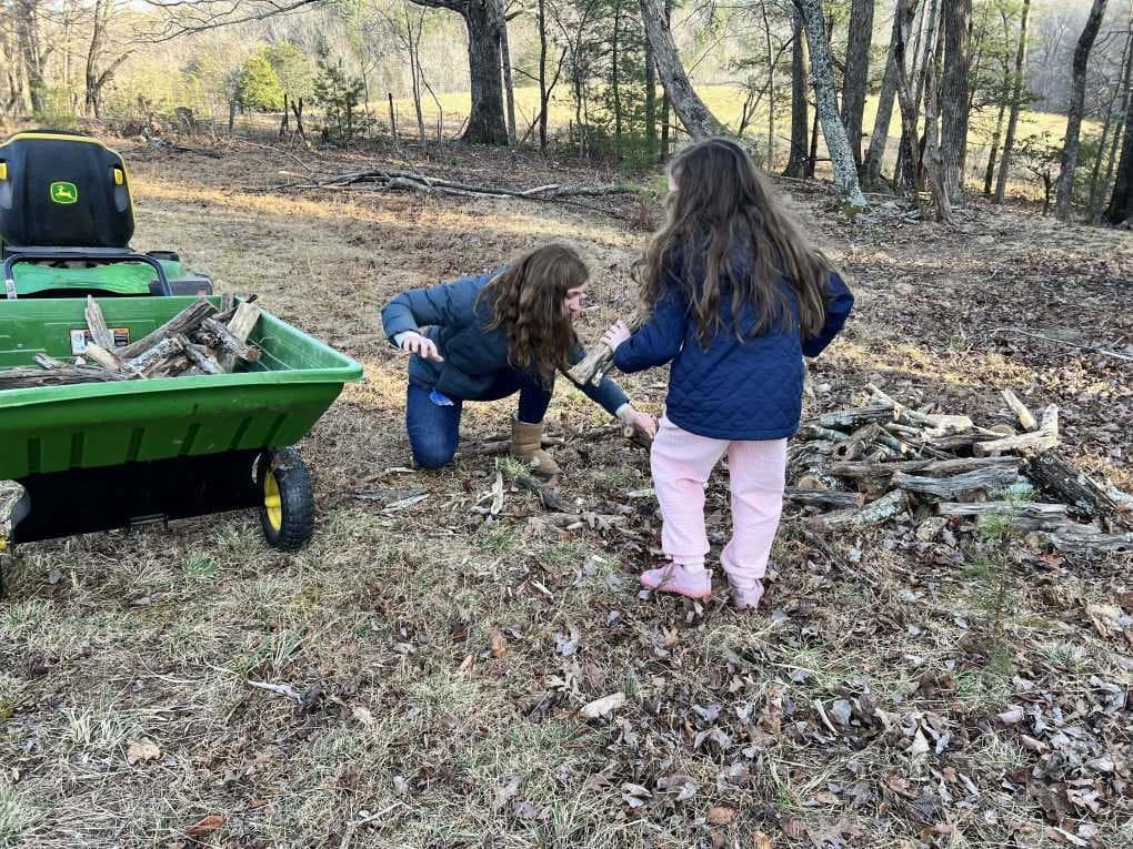 kids picking up firewood