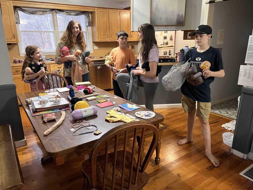 kids having a birthday party for a doll