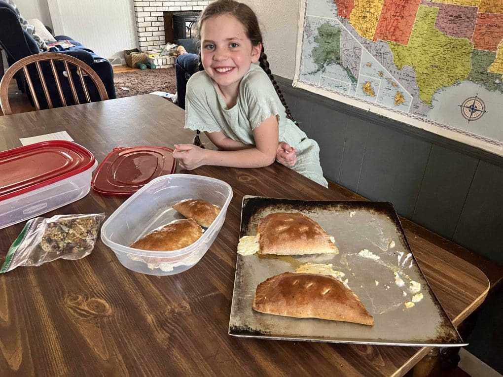 girl making cheese calzones