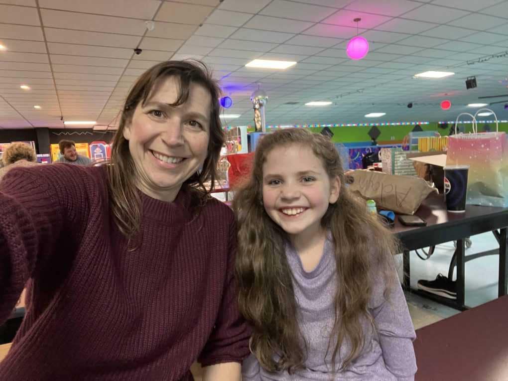 mom and daughter at skating rink