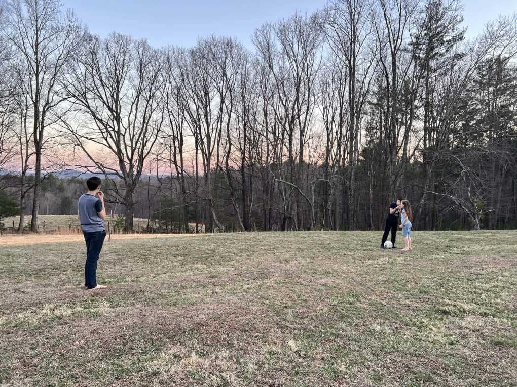 3 kids playing in a field in winter