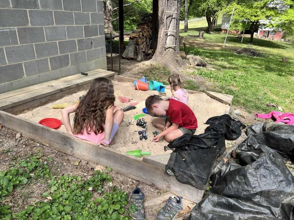 kids playing in sandbox