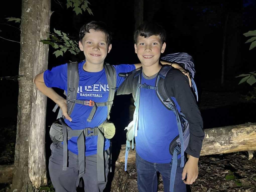 two brothers going on a night hike