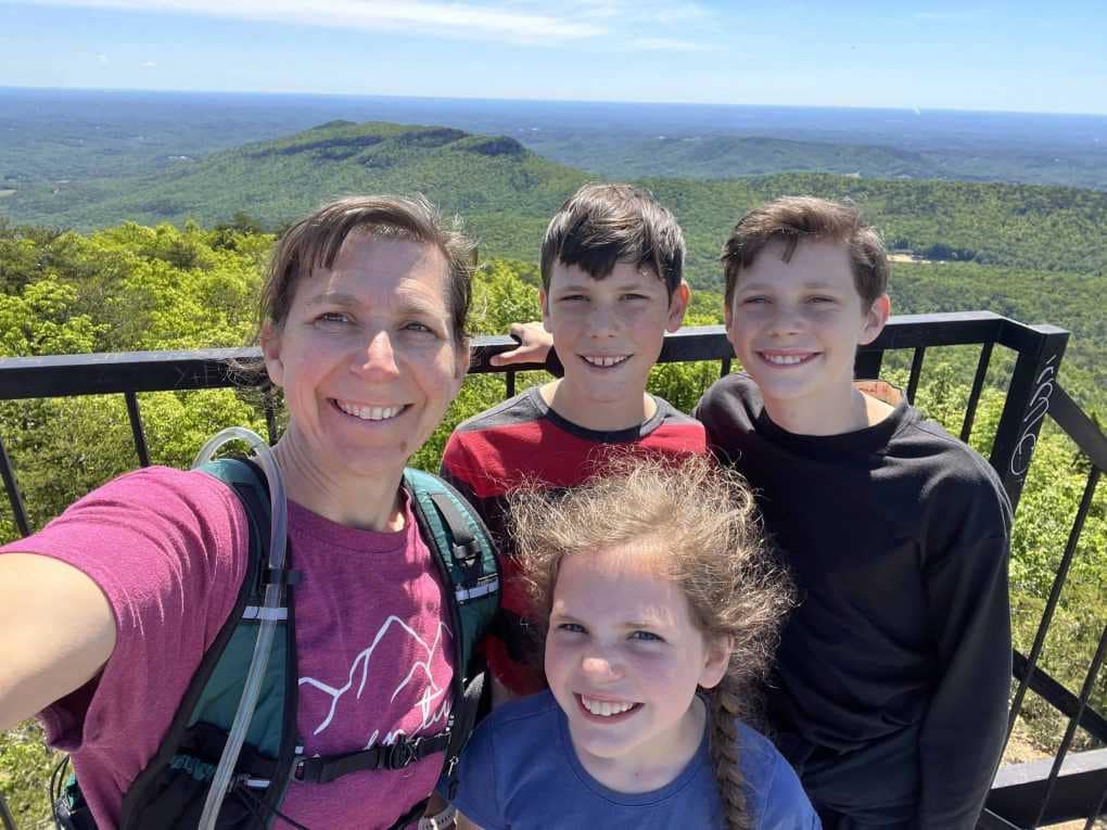 mom and children on fire tower with view