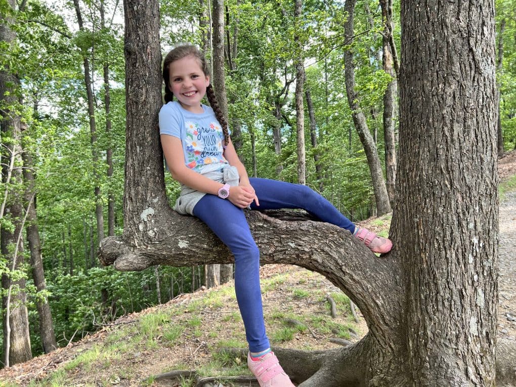 girl sitting in a tree