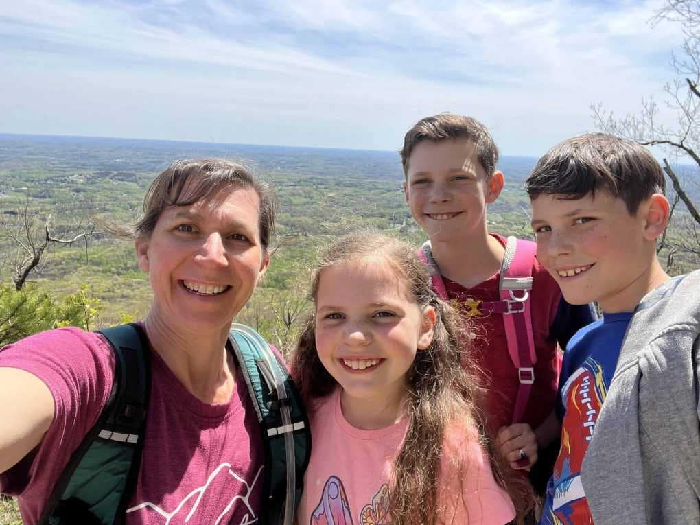 mom and 3 kids hiking Pilot Mountain