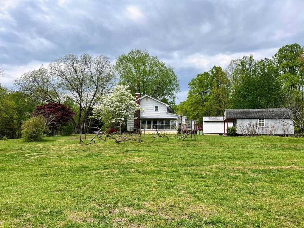 farmhouse, sunroom and property in spring