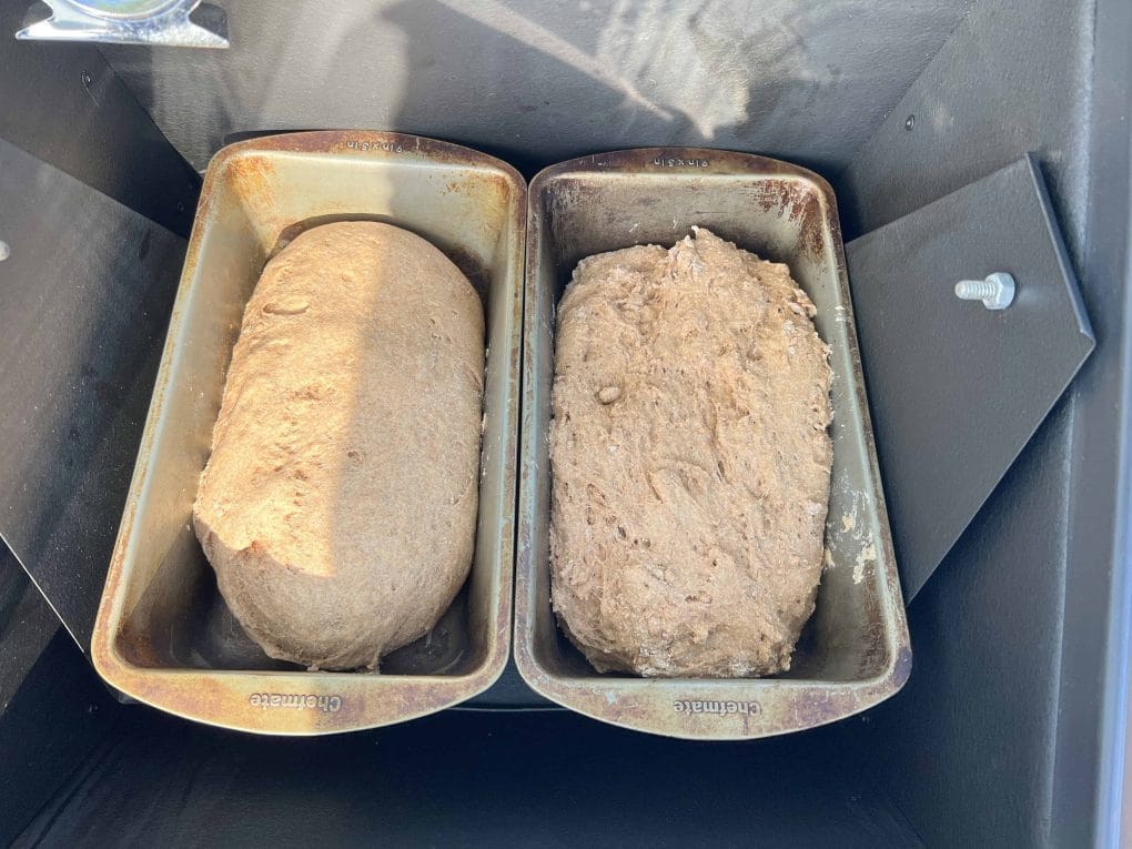 two loaves of bread baking in a sun oven