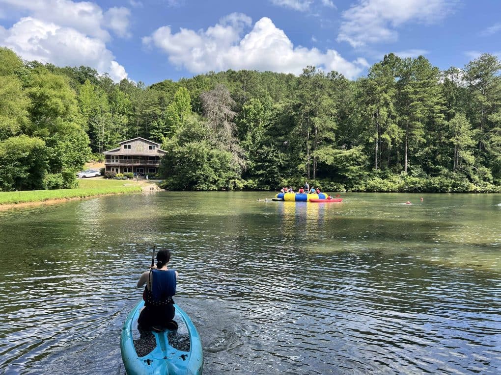 lake with a lodge in the background