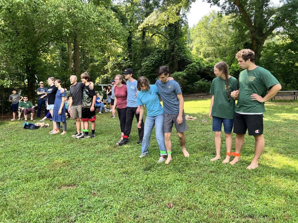 older kids doing 3 legged race