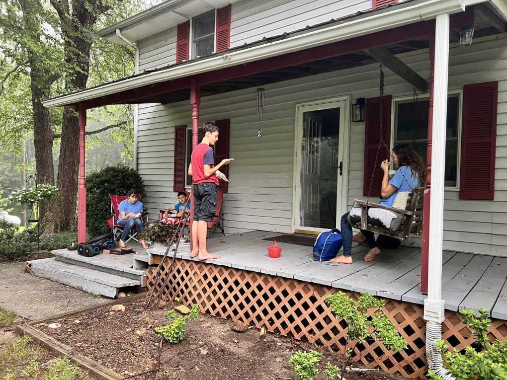 kids on the front porch doing a devotional