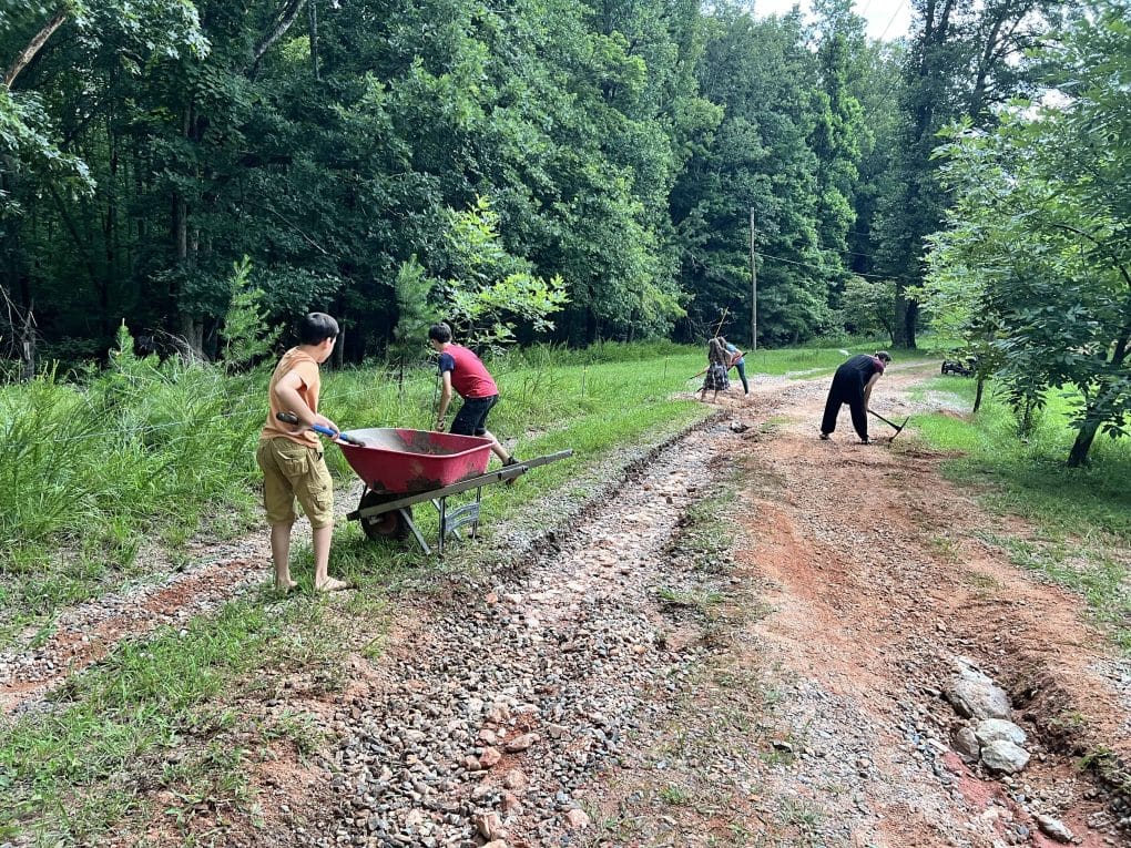 family fixing messed up driveway