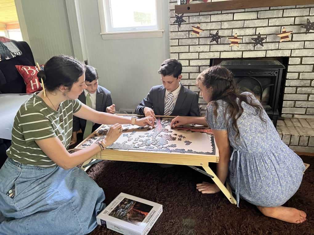 siblings doing a puzzle