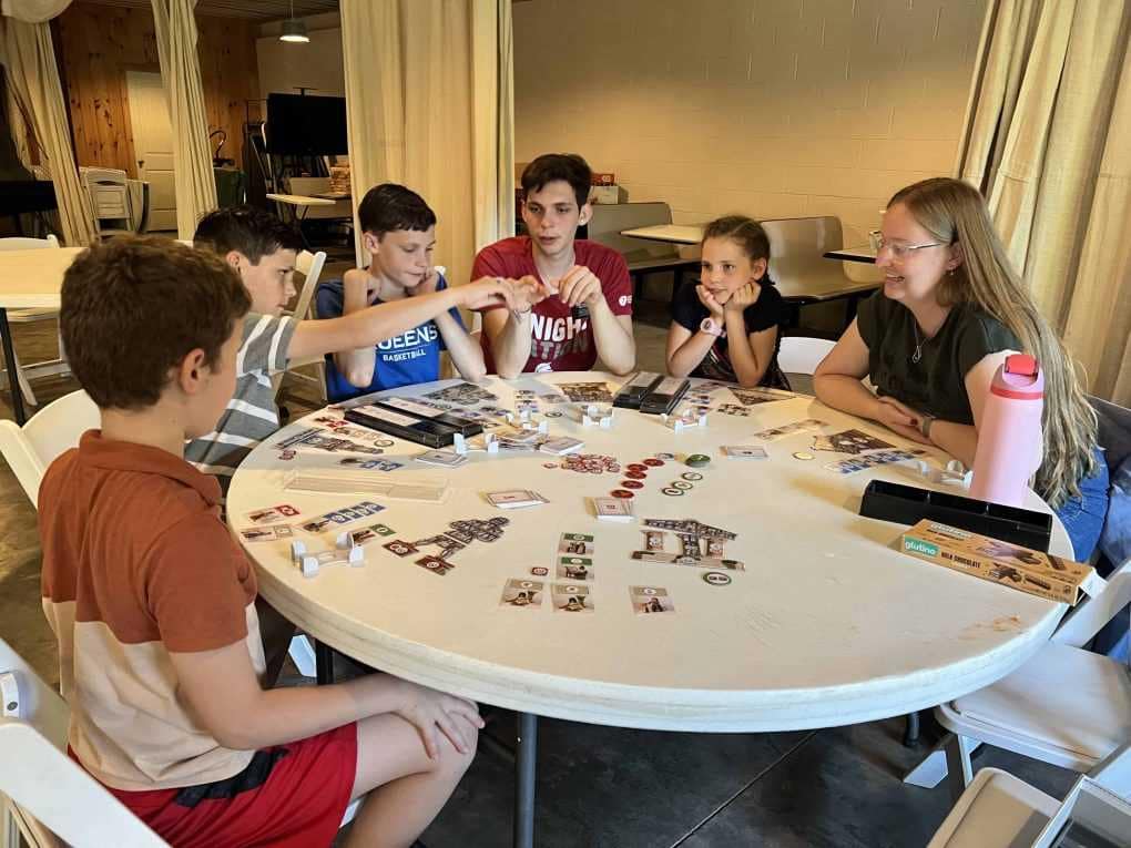 siblings playing games at family reunion
