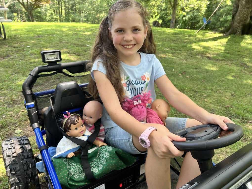 girl driving ride on toy