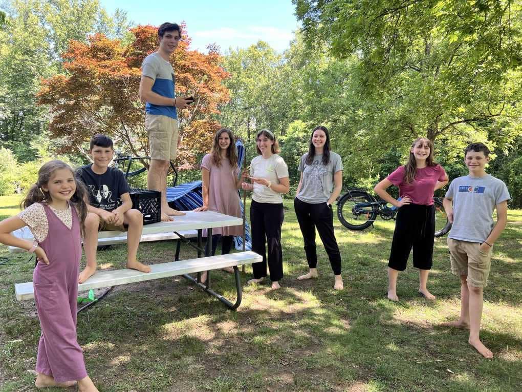 siblings practicing a skit outside