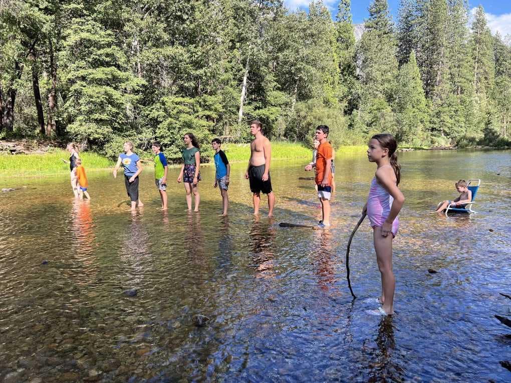 kids playing in the river at Yosemite