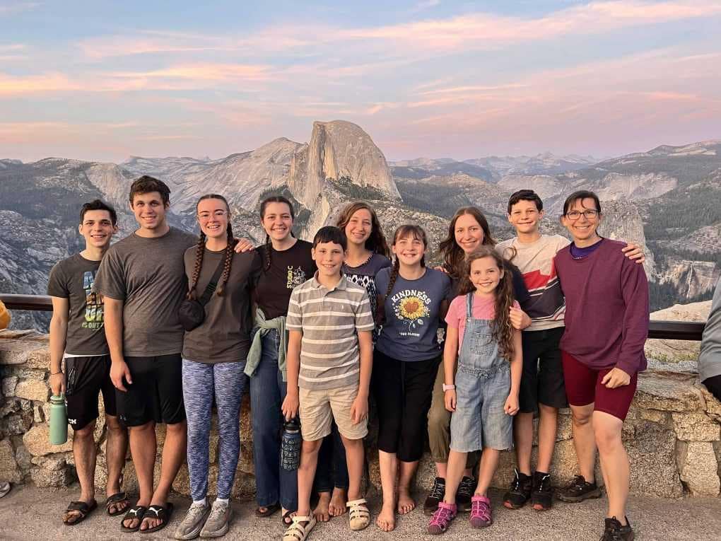 family in front of Half Dome
