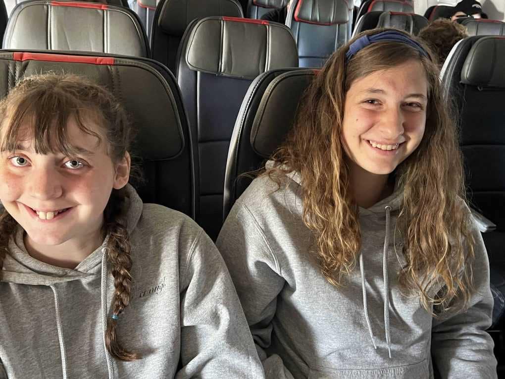 2 sisters on airplane