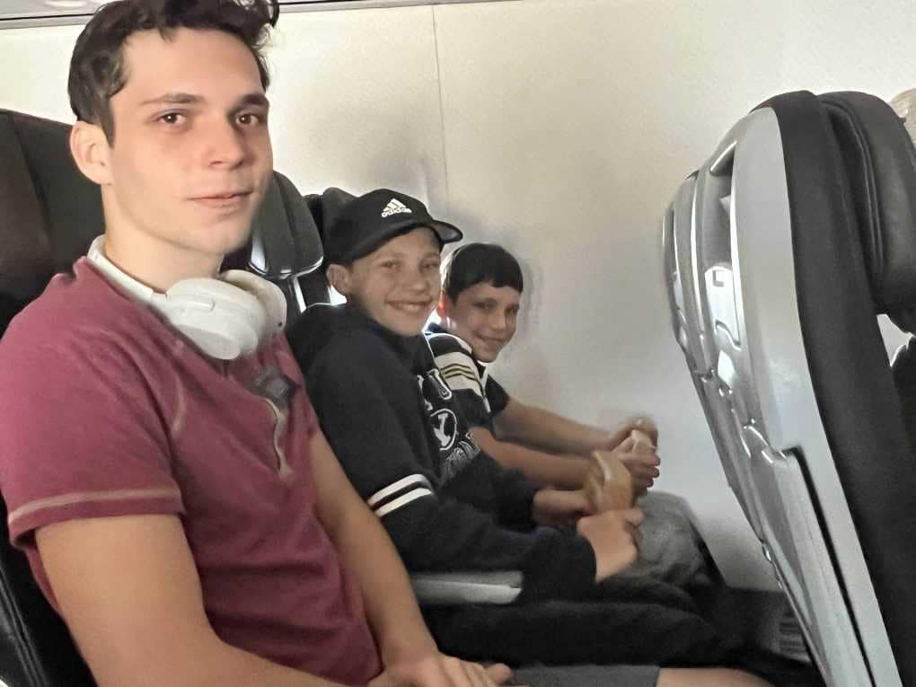 3 brothers on airplane