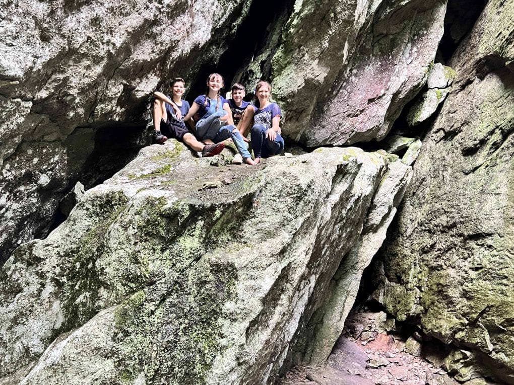 4 kids on a huge boulder