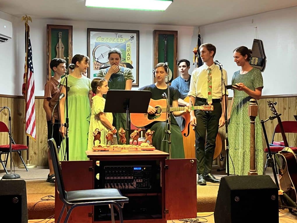 siblings singing at a jam session