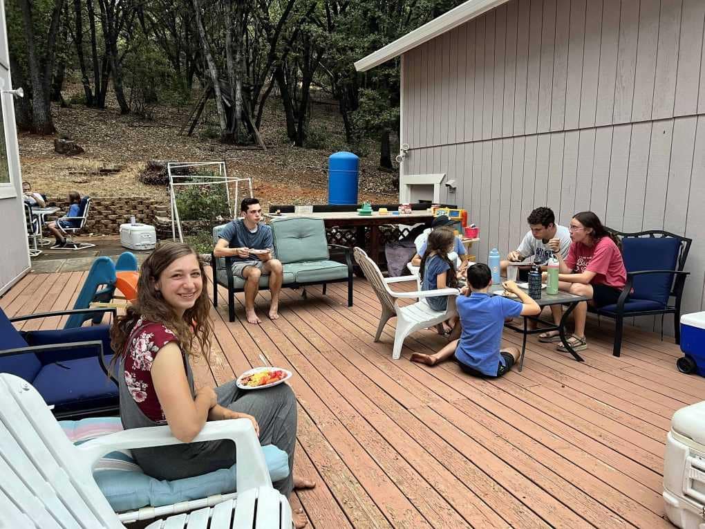 family eating on the deck