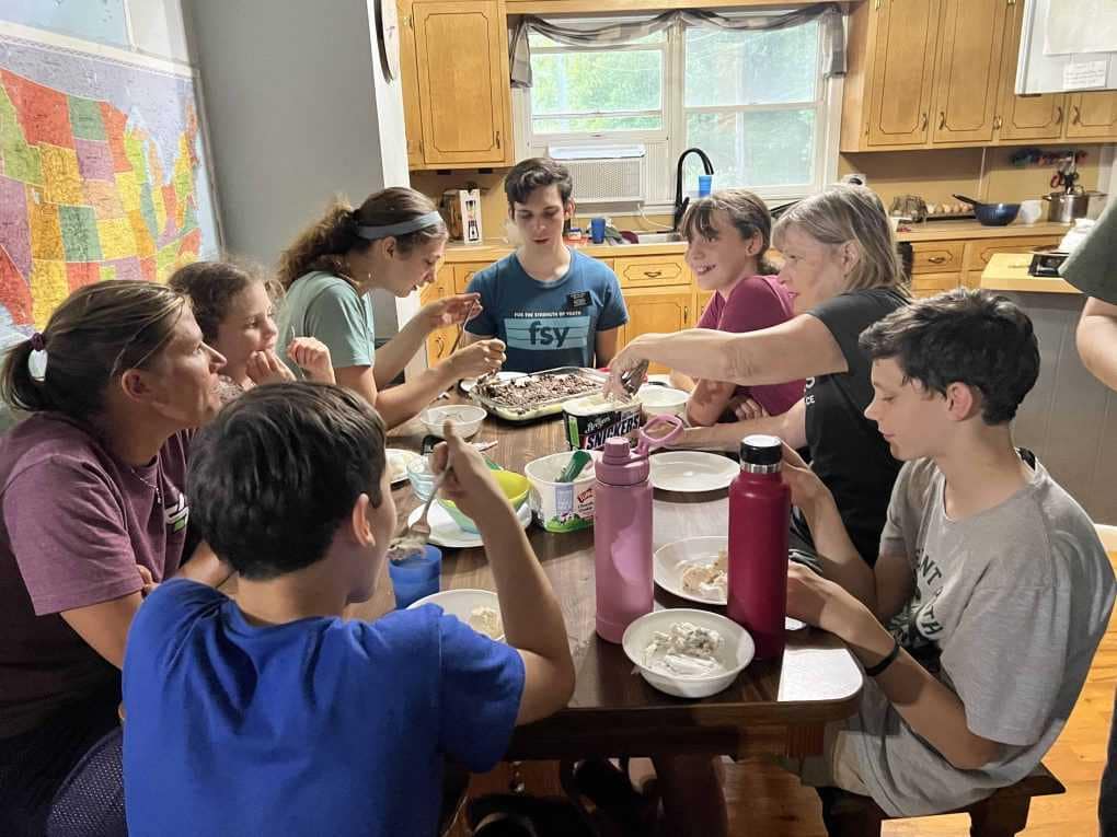 family serving brownies and ice cream